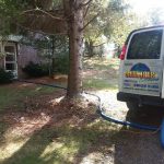 Truck parked at customer home with hoses run in