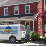 Carpet cleaning van at house and hooked up to clean