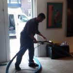 Tech cleaning carpet